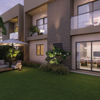 Side elevation view of Riviera Uno 4 BHK triplex villa with sprawling terraces and landscaped surroundings